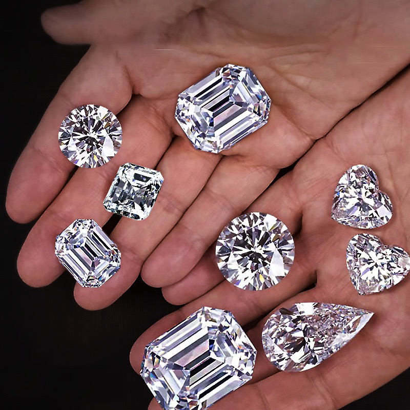 A curated collection of loose lab-grown diamonds cupped in a hand