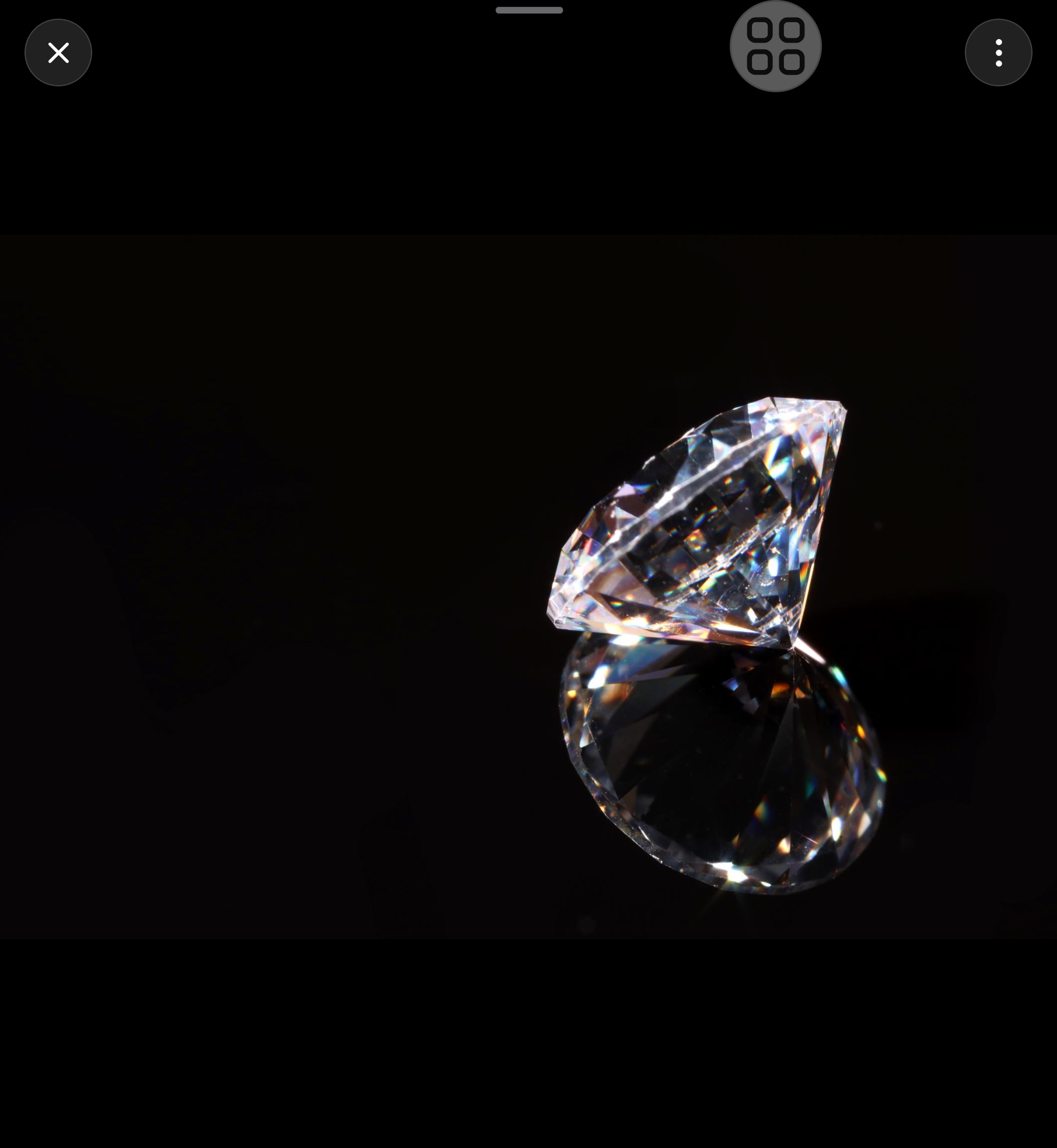 Lab-grown diamond mirrored in a reflective surface