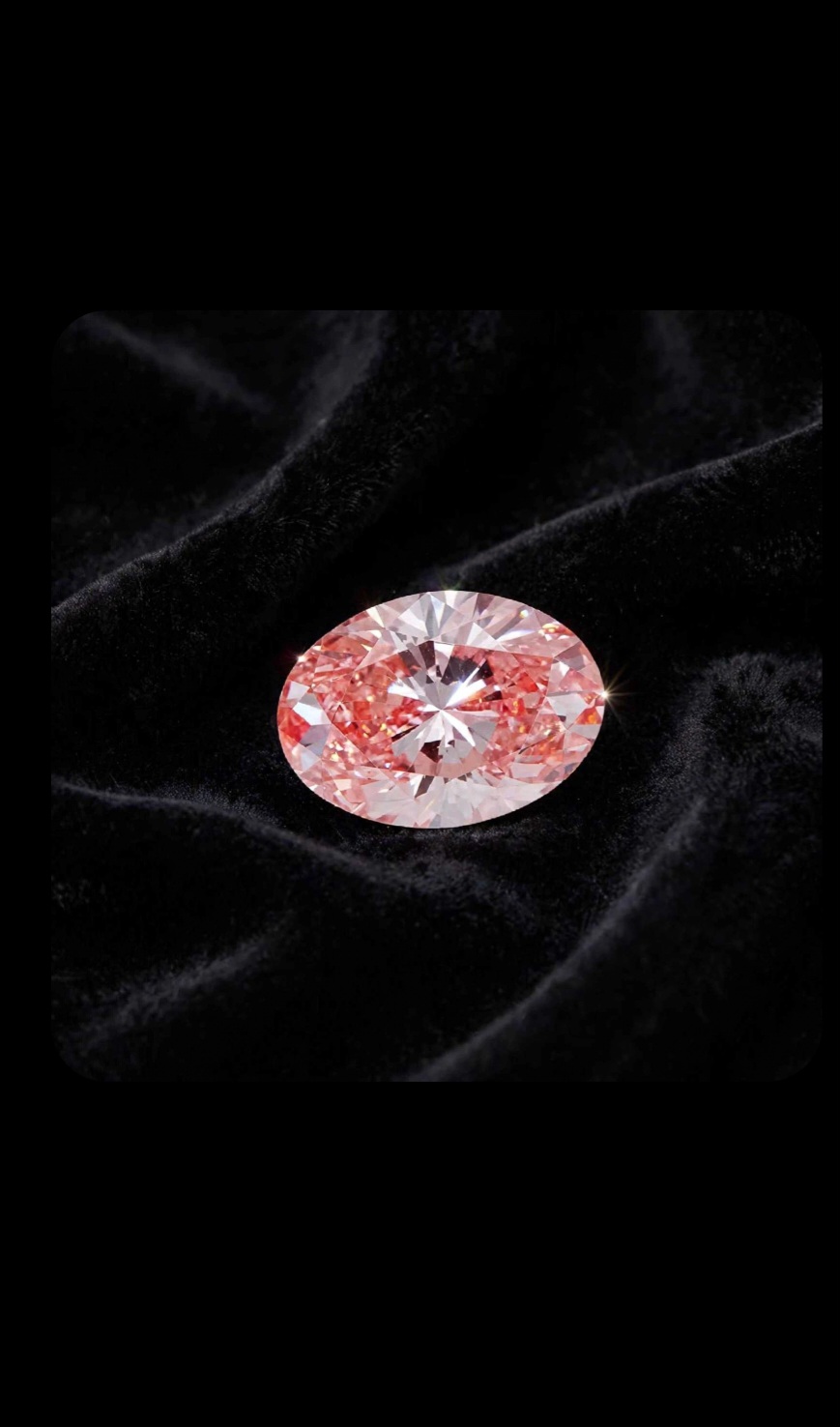 Fancy Vivid Pink lab-grown diamond, oval cut, on black velvet — IGI Fancy Vivid certified