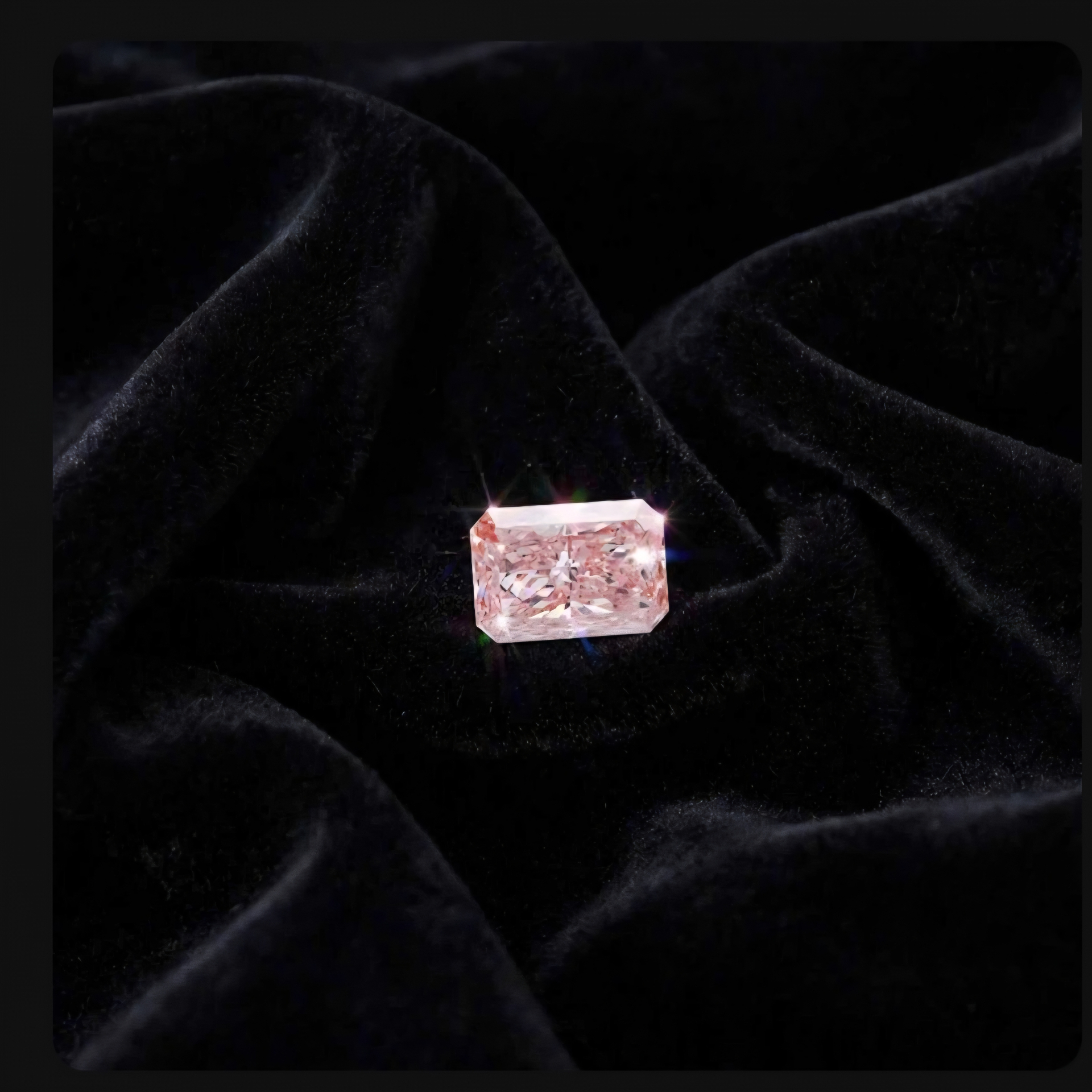 Fancy Vivid Pink lab-grown diamond, radiant cut variation, on black velvet — IGI Fancy Vivid certified