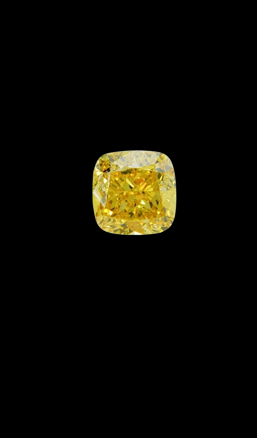 Fancy Vivid Yellow lab-grown diamond, cushion cut, on black velvet — IGI Fancy Vivid certified