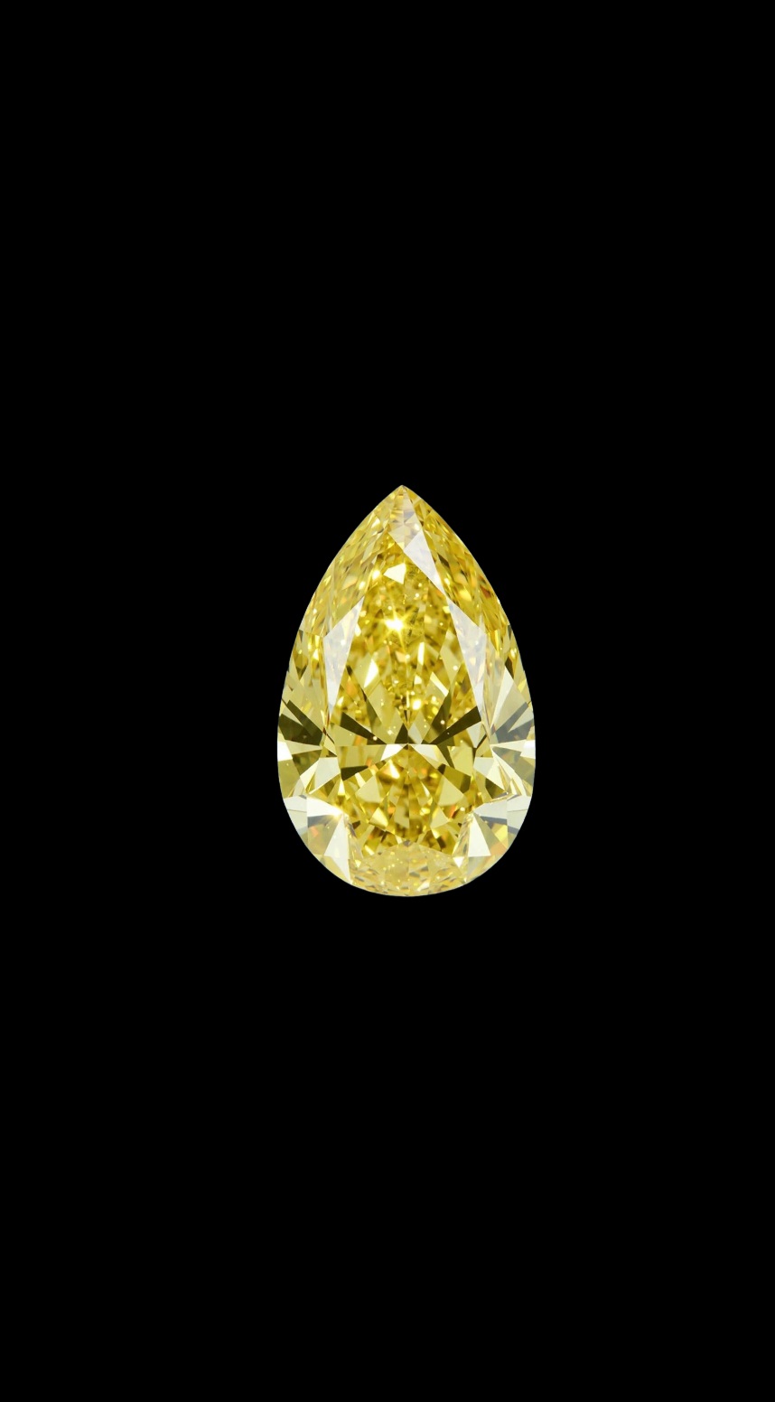 Fancy Vivid Yellow lab-grown diamond, pear cut, on black velvet — IGI Fancy Vivid certified